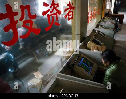 (160229) -- NANJING, Feb. 29, 2016 -- An investor looks through stock information at a trading hall in Nanjing, capital of east China s Jiangsu Province, Feb. 29, 2016. Chinese shares dived below the 2,700-point mark on Monday, ending February at their lowest ebb in the month. The benchmark Shanghai Composite Index plunged 2.86 percent to close at 2,687.98 points while the smaller Shenzhen index declined 4.98 percent to end the day at 9,097.36 points. ) (wyo) CHINA-STOCK-DOWNTURN (CN) JixChunpeng PUBLICATIONxNOTxINxCHN   Nanjing Feb 29 2016 to Investor Looks Through Stick Information AT a Trad Stock Photo