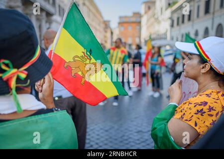 Rome, Italy. 31st Aug, 2023. August 31, 2023, Rome, Italy: An Ethiopian flag with the Ethiopian imperial-era Lion of Judah, a central symbol in Rastafarian and Ethiopian culture, is waved during a protest demonstration against the persecution of the Amhara in Ethiopia held in Rome.According to the United Nations High Commissioner for Human Rights (OHCHR), at least 183 people have been killed in clashes in the Amhara region. After the proclamation of the state of emergency at least 1,000 people were arrested: many belonging to the Amhara ethnic group and suspected of supporting the Fano militi Stock Photo