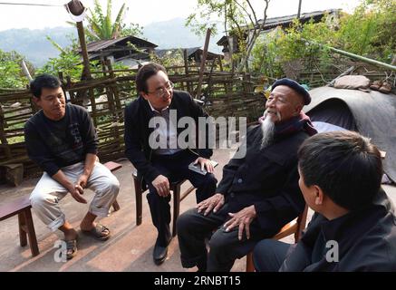 (160311) -- BEIJING, March 11, 2016 -- Jiao Jialiang (2nd L) talks with villager Zhang Zhiliang (2nd R) in Lianhe Village of Jiangcheng County, southwest China s Yunnan Province, Feb. 22, 2016. Jiao is a member of the 12th National Committee of the Chinese People s Political Consultative Conference and chairman of Ideality Technology Group. Since 2015, he has started a survey in poor villages of Lincang, Baoshao, Chuxiong and Pu er, and talked with local villagers of ethnic minorities. During the ongoing annual session of the country s top political advisory body, Jiao put forwards a proposal Stock Photo