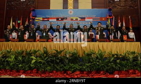 (160314) -- VIENTIANE, March 14, 2016 -- Chiefs of defence forces of the Association of Southeast Asian Nations (ASEAN) member states raise linked hands for the 13th ASEAN Chiefs of Defence Forces Informal Meeting in Vientiane, Laos, March 14, 2016. Natural and man-made disasters, climate change, trafficking, terrorism, cyber, maritime and other non-traditional security challenges were among key focus areas as top-ranked military personnel from across South-East Asia met for the 13th ASEAN Chiefs of Defence Forces Informal Meeting in the Lao capital on Monday. ) LAOS-VIENTIANE-ASEAN-DEFENCE FO Stock Photo