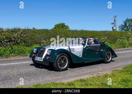 Morgan Plus Four Silver Green Car Roadster PetroL 1999 cc en-route to Capesthorne Hall classic car show, Cheshire, UK Stock Photo