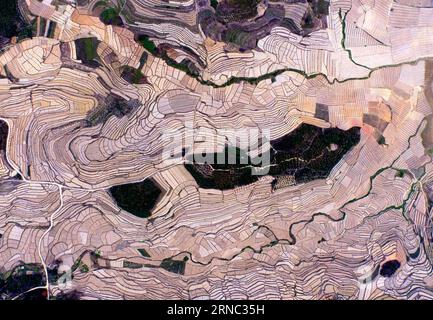 (160320) -- Photo taken on March 14, 2016 shows an aerial view of watermelon terraces in Xibeile Village under Yongle Township in Baise City, south China s Guangxi Zhuang Autonomous Region. ) XINHUA PHOTO WEEKLY CHOICES HuangxXiaobang PUBLICATIONxNOTxINxCHN   Photo Taken ON March 14 2016 Shows to Aerial View of Watermelon Terraces in  Village Under Yongle Emperor Township in Baise City South China S Guangxi Zhuang Autonomous Region XINHUA Photo Weekly Choices HuangxXiaobang PUBLICATIONxNOTxINxCHN Stock Photo