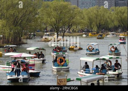 (160403) -- BEIJING, April 3, 2016 -- Visitors boat at Chaoyang Park in Beijing, capital of China, April 3, 2016. Quite a number of people went for spring outing on the second day of the three-day Qingming Festival, or Tomb-sweeping Day. ) (mp) CHINA-BEIJING-HOLIDAY (CN) JuxHuanzong PUBLICATIONxNOTxINxCHN   Beijing April 3 2016 Visitors Boat AT Chao Yang Park in Beijing Capital of China April 3 2016 quite a Number of Celebrities Went for Spring Outing ON The Second Day of The Three Day Qing Ming Festival or Tomb Sweeping Day MP China Beijing Holiday CN JuxHuanzong PUBLICATIONxNOTxINxCHN Stock Photo