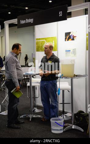 (160421) -- JOHANNESBURG, April 21, 2016 -- An exhibitor(R) shows a village bucket filter whose life span is 10 years and price 450 Rand (about 32 US Dollars), during the opening day of Hack4Water Exhibition, Johannesburg, South Africa, on April 21, 2016. The Department of Water and Sanitation of South Africa in collaboration with Open Government Partnership, South Africa hosted a Hack4Water showcase event here Thursday. Researchers and entrepreneurs presented innovations and ideas that could assist to address South Africa s water and sanitation challenges at a low cost. ) SOUTH AFRICA-JOHANNE Stock Photo