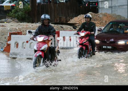 (160426) -- KUALA LUMPUR, April 26, 2016 -- Local residents ride motorcycles on flooded streets due to heavy rain in Kuala Lumpur, Malaysia, April 26, 2016. ) MALAYSIA-KUALA LUMPUR-HEAVY RAIN ChongxVoonxChung PUBLICATIONxNOTxINxCHN   160426 Kuala Lumpur April 26 2016 Local Residents Ride Motorcycles ON flooded Streets Due to Heavy Rain in Kuala Lumpur Malaysia April 26 2016 Malaysia Kuala Lumpur Heavy Rain ChongxVoonxChung PUBLICATIONxNOTxINxCHN Stock Photo