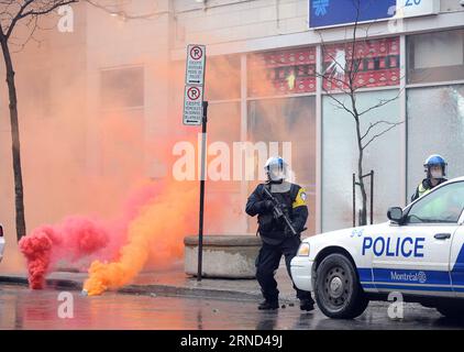 MONTREAL, May 1, 2016 -- Policemen stand guard during an anti-capitalist protest in downtown Montreal, Canada, on May 1, 2016. Several hundred demonstrators take part in the protest on Sunday. Kadrid Mohamed) CANADA-MONTREAL-LABOR DAY-PROTEST libaodong PUBLICATIONxNOTxINxCHN   Montreal May 1 2016 Policemen stand Guard during to Anti Capitalist Protest in Downtown Montreal Canada ON May 1 2016 several Hundred demonstrator Take Part in The Protest ON Sunday  Mohamed Canada Montreal Laboratory Day Protest libaodong PUBLICATIONxNOTxINxCHN Stock Photo