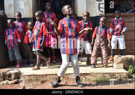(160531) -- NAIROBI, May 31, 2016 -- Photo taken on May 29, 2016 shows children singing rap songs and dancing at the Sejorooney Kids Talent Center, at the Mathare slums in Nairobi, Kenya. When the Kenyan duo of Dominic Senerwa and Joseph Mwangi acquired a disused building at the local police post in Mathare slums in Nairobi for philanthropic work, little did they know that their pet project would come to realization. Senerwa, 21, and Mwangi, 23, embarked on their charitable mission to turn around the lives of children from rundown homes within the informal settlement, having grown up in the du Stock Photo