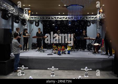 (160612) -- KUNMING, June 12, 2016 -- Robot musicians play during a live show in a robot experience center in Kunming, capital of southwest China s Yunnan Province, June 12, 2016. ) (cxy) CHINA-KUNMING-ROBOT EXPERIENCE CENTER (CN) HuxChao PUBLICATIONxNOTxINxCHN   160612 Kunming June 12 2016 Robot Musicians Play during a Live Show in a Robot Experience Center in Kunming Capital of Southwest China S Yunnan Province June 12 2016 Cxy China Kunming Robot Experience Center CN HuxChao PUBLICATIONxNOTxINxCHN Stock Photo