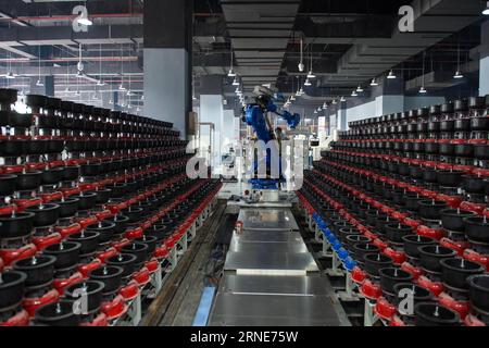 (160612) -- KUNMING, June 12, 2016 -- A polishing robot works at site in a robot experience center in Kunming, capital of southwest China s Yunnan Province, June 12, 2016. ) (cxy) CHINA-KUNMING-ROBOT EXPERIENCE CENTER (CN) HuxChao PUBLICATIONxNOTxINxCHN   160612 Kunming June 12 2016 a polishing Robot Works AT Site in a Robot Experience Center in Kunming Capital of Southwest China S Yunnan Province June 12 2016 Cxy China Kunming Robot Experience Center CN HuxChao PUBLICATIONxNOTxINxCHN Stock Photo