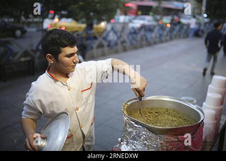 , June 19, 2016 -- An Iranian worker prepares traditional food for the Iftar meal, the meal eaten by Muslims to break their fast after sunset every day during the holy month of Ramadan, in downtown , Iran, on June 19, 2016. Ahmad Halabisaz) IRAN--RAMADAN Tehran PUBLICATIONxNOTxINxCHN   June 19 2016 to Iranian Worker Prepares Traditional Food for The Iftar Meal The Meal eaten by Muslims to Break their Almost After Sunset Every Day during The Holy Month of Ramadan in Downtown Iran ON June 19 2016 Ahmad Halabisaz Iran Ramadan TEHRAN PUBLICATIONxNOTxINxCHN Stock Photo