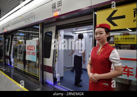 (160628) -- SHENZHEN, June 28, 2016 -- An attendant waits for passengers at Futian Station of newly-opened subway line 11 which directly links Shenzhen Airport with Futian station on Guangzhou-Shenzhen-Hong Kong Express Rail Link, in Shenzhen, south China s Guangdong Province, June 28, 2016. ) (wyl) CHINA-SHENZHEN-SUBWAY-AIRPORT (CN) MaoxSiqian PUBLICATIONxNOTxINxCHN   160628 Shenzhen June 28 2016 to attendant Waits for Passengers AT Futian Station of newly opened Subway Line 11 Which directly left Shenzhen Airport With Futian Station ON Guangzhou Shenzhen Hong Kong Shipping Rail Link in Shenz Stock Photo