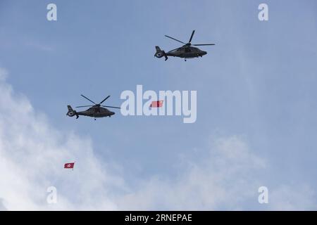 (160701) -- HONG KONG, July 1, 2016 -- Helicopters carrying the Chinese national flag (R) and the flag of Hong Kong Special Administrative Region (HKSAR) fly over the Golden Bauhinia Square during a flag raising ceremony in Hong Kong, south China, July 1, 2016, to celebrate the 19th anniversary of the establishment of the HKSAR. ) (ry) CHINA-HONG KONG-RETURN-19TH ANNIVERSARY(CN) LuixSiuxWai PUBLICATIONxNOTxINxCHN   Hong Kong July 1 2016 Helicopters carrying The Chinese National Flag r and The Flag of Hong Kong Special Administrative Region HKSAR Fly Over The Golden Bauhinia Square during a Fla Foto Stock