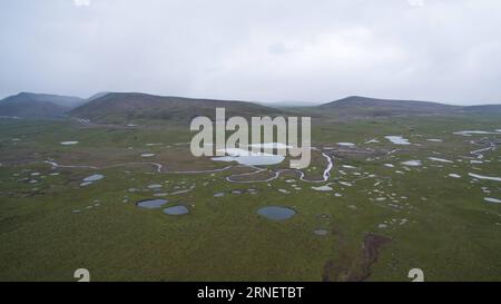 (160704) -- SHIQU, July 4, 2016 -- An aerial photo taken on June 29, 2016 shows a part of Zhajiaba Wetland at the Changsha-Gongma National Nature Reserve in Shiqu County, southwest China s Sichuan Province. Experts have found various types of wetlands after 7-day investigation on wetlands in Shiqu County. Shiqu County, which is located on the southeastern part of the Qinghai-Tibet Plateau, covers an area of 1.1 million hectares of wetlands. These wetlands play a role in keeping ecological balance of the sources of the Yangtze River and the Yellow River. ) (lfj) CHINA-SICHUAN-SHIQU-WETLANDS (CN Stock Photo