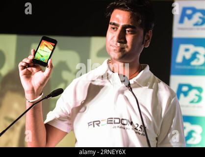 (160707) -- NEW DELHI, July 7, 2016 -- Mohit Goel, CEO of Indian mobile phone company Ringing Bells, demonstrates the retailing type of smartphone Freedom 251 during a press conference held in New Delhi, capital of India, July 7, 2016. Freedom 251, whose price is only 251 Indian Rupees (around 4 USD), would kick off the delivery on Friday. But only 5000 of more than 70 million orders would be satisfied due to manufacture capacity and cost, said Goel Wednesday. ) (zjy) INDIA-NEW DELHI-ECONOMICAL SMARTPHONE BixXiaoyang PUBLICATIONxNOTxINxCHN   160707 New Delhi July 7 2016 Mohit Goel CEO of India Stock Photo