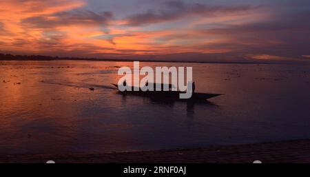 (160710) -- SIRAJGANJ, July 8, 2016 -- People enjoy the sunset on Jamuna river during the Eid al-Fitr festival , which marks the end of the Islamic holy month of Ramadan, in Sirajganj, Bangladesh, on July 8, 2016. ) BANGLADESH-SIRAJGANJ-EID AL-FITR FESTIVAL SharifulxIslam PUBLICATIONxNOTxINxCHN   160710 Sirajganj July 8 2016 Celebrities Enjoy The Sunset ON Jamuna River during The Oath Al Fitr Festival Which Marks The End of The Islamic Holy Month of Ramadan in Sirajganj Bangladesh ON July 8 2016 Bangladesh Sirajganj Oath Al Fitr Festival SharifulxIslam PUBLICATIONxNOTxINxCHN Stock Photo