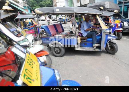 (160711) -- BANGKOK, July 11, 2016 -- A Thai tuk-tuk (Thai taxi) driver rides his motor tricycle, a common part of Thailand s transportation vehicle which is very popular among foreign tourists, in Bangkok, Thailand, July 11, 2016. ) THAILAND-BANGKOK-TRANSPORTATION-TUK TUK RachenxSageamsak PUBLICATIONxNOTxINxCHN   160711 Bangkok July 11 2016 a Thai Tuk Tuk Thai Taxi Driver Rides His Engine Tricycle a Common Part of Thai country S Transportation Vehicle Which IS very Popular among Foreign tourists in Bangkok Thai country July 11 2016 Thai country Bangkok Transportation Tuk Tuk RachenxSageamsak Stock Photo