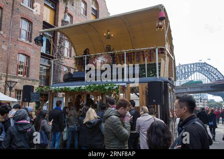 (160724) -- SYDNEY, July 24, 2016 -- Players perform live music at the Rocks Aroma Festival in Sydney, Australia, July 24, 2016. The Rocks Aroma Festival kicked off on Sunday in Sydney, where people can taste treats from boutique coffee roasters, chocolatiers and tea-makers. Zhu Hongye) (sxk) AUSTRALIA-SYDNEY-ROCKS AROMA FESTIVAL HongyexZhu PUBLICATIONxNOTxINxCHN   160724 Sydney July 24 2016 Players perform Live Music AT The Rocks Aroma Festival in Sydney Australia July 24 2016 The Rocks Aroma Festival kicked off ON Sunday in Sydney Where Celebrities CAN Button Treats from Boutique Coffee Roas Stock Photo