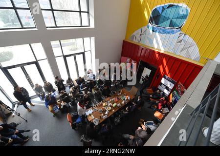 Entrepreneurs talk with each other during a symposium at the Internet Village of Dream Town in Hangzhou, capital city of east China s Zhejiang Province, Feb. 24, 2016. Thousands of smaller online shopping businesses are clustered in Hangzhou, home to e-commerce giant Alibaba. The city, praised by Italian traveler Marco Polo in the 13th century as the world s most magnificent and noble city, is little-known compared with Beijing and Shanghai, but has much to offer and is a window on new trends in China. )(mp) (G20 SUMMIT)CHINA-HANGZHOU-INNOVATIVE CITY (CN) HuangxZongzhi PUBLICATIONxNOTxINxCHN Stock Photo