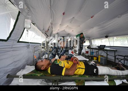 CHONBURI, Sept. 8, 2016 -- A Chinese medical officer offers treatment to the injured during the ASEAN Defense Ministers Meeting-Plus Military Medicine-Humanitarian Assistance and Disaster Relief Joint Exercise (AM-HEx 2016) in Chonburi, Thailand on Sept. 8, 2016. Troops from 18 countries -- 10 ASEAN member states and its eight dialogue partners on Monday began a joint exercise on humanitarian assistance and disaster relief here in Thailand. )(axy) THAILAND-CHONBURI-AM-HEX 2016-JOINT EXERCISE LixMangmang PUBLICATIONxNOTxINxCHN   Chonburi Sept 8 2016 a Chinese Medical Officer OFFERS Treatment to Stock Photo