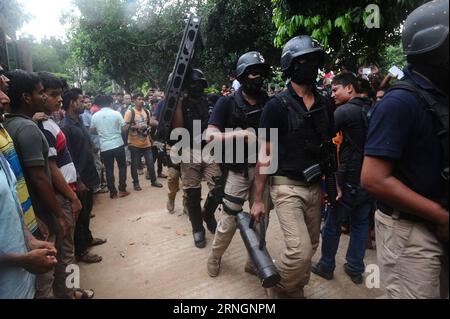 (161008) -- DHAKA, Oct. 8, 2016 -- Police and elite force Rapid Action Battalion (Rab) members conduct an operation on a hideout of banned Islamist outfit Jamaatul Mujahideen Bangladesh (JMB) in Gazipur on the outskirts of Dhaka, Bangladesh, Oct. 8, 2016. The Bangladeshi government came down hard on homegrown militants through a number of drives, killing 11 suspected militants in operations conducted by law enforcement agencies in different regions on Saturday, officials said. )(zf) BANGLADESH-DHAKA-JOINT FORCE-OPERATIONS JibonxAhsan PUBLICATIONxNOTxINxCHN   Dhaka OCT 8 2016 Police and Elite F Stock Photo