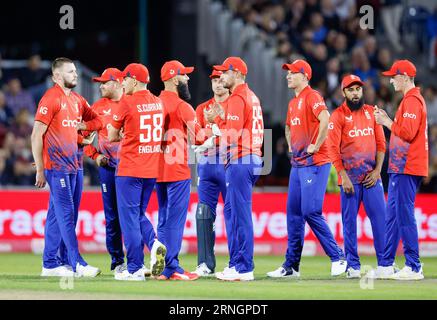 Old Trafford, Manchester, UK. 1st Sep, 2023. 2nd IT20, England versus New Zealand; Gus Atkinson of England (L) is congratulated by team mates after taking the wicket of Tim Southee (C) of New Zealand lbw for 8 Credit: Action Plus Sports/Alamy Live News Stock Photo