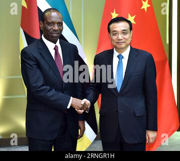 (161010) -- BEIJING, Oct. 10, 2016 -- Chinese Premier Li Keqiang(R) shakes hands with his Mozambican counterpart Carlos Agostinho do Rosario, who is in Macao for the opening ceremony of the fifth Ministerial Conference of the Forum for Economic and Trade Cooperation between China and Portuguese-speaking countries in Macao, south China, Oct. 10, 2016. ) (zhs) CHINA-MACAO-LI KEQIANG-MOZAMBIQUE-ROSARIO-MEET (CN) LixTao PUBLICATIONxNOTxINxCHN   Beijing OCT 10 2016 Chinese Premier left Keqiang r Shakes Hands With His Mozambican Part Carlos Agostinho Do Rosario Who IS in Macao for The Opening Ceremo Stock Photo