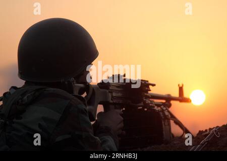 (161107) -- BASHIQAH (IRAQ), Nov. 7, 2016 () -- A soldier of Kurdish security forces, known as Peshmerga, guards the front line outside the town of Bashiqah, some 30 km northeast of Mosul, Iraq, on Nov. 7, 2016. Kurdish security forces, known as Peshmerga, freed Monday a town from the Islamic State (IS) militants near the city of Mosul, a Kurdish security source said. The Peshmerga forces, backed by U.S.-led coalition airstrikes, started in the morning their operation to storm the town of Bashiqah, some 30 km northeast of Mosul, and managed to seize the town after fierce clashes during the day Stock Photo