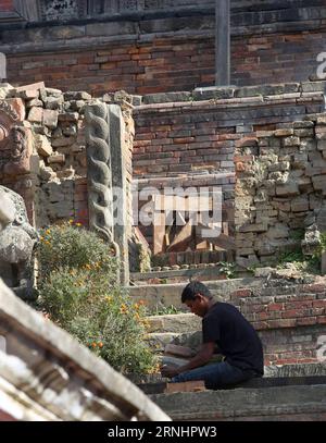 (161205) -- KATHMANDU, Dec. 5, 2016 -- A worker works at the reconstruction site of Taleju temple at Hanumandhoka Durbar Square, a UNESCO heritage site in Kathmandu, Nepal, Dec. 5, 2016. Temples at Hanumandhoka Durbar Square damaged during the devastating earthquake last year are in process of reconstruction. ) (zjy) NEPAL-KATHMANDU-RECONSTRUCTION SunilxSharma PUBLICATIONxNOTxINxCHN   Kathmandu DEC 5 2016 a Worker Works AT The Reconstruction Site of Taleju Temple AT Hanumandhoka Durbar Square a Unesco Heritage Site in Kathmandu Nepal DEC 5 2016 Temples AT Hanumandhoka Durbar Square damaged dur Stock Photo