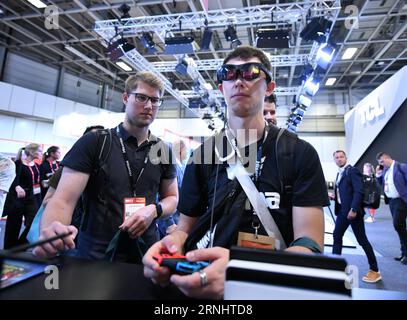 (230901) -- BERLIN, Sept. 1, 2023 (Xinhua) -- A visitor experiences an extended reality device at the booth of Chinese company TCL during the IFA 2023 in Berlin, capital of Germany, on Sept. 1, 2023. As one of the world's leading trade fairs for consumer electronics, the five-day IFA 2023 opened here on Friday with over 2,000 exhibitors from 48 countries and regions, a much greater scale than last year. According to IFA official website, nearly 1,300 Chinese exhibitors have registered in this year's event. Chinese companies such as Hisense, TCL and Haier have occupied some of the largest exhib Stock Photo