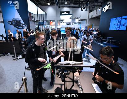 (230901) -- BERLIN, Sept. 1, 2023 (Xinhua) -- People visit the booth of Chinese company DJI during the IFA 2023 in Berlin, capital of Germany, on Sept. 1, 2023. As one of the world's leading trade fairs for consumer electronics, the five-day IFA 2023 opened here on Friday with over 2,000 exhibitors from 48 countries and regions, a much greater scale than last year. According to IFA official website, nearly 1,300 Chinese exhibitors have registered in this year's event. Chinese companies such as Hisense, TCL and Haier have occupied some of the largest exhibit areas with various products. (Xinhua Stock Photo