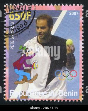 BENIN - CIRCA 2007: Timbro stampato dal Benin, mostra Pete Sampras, Disney Caharacter e Olympic Rings, circa 2007 Foto Stock