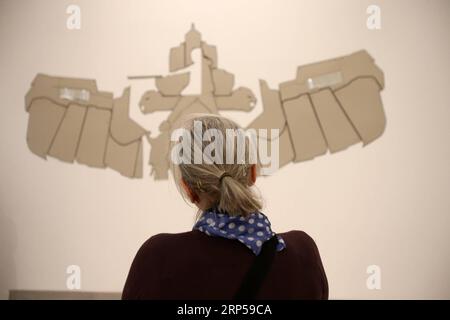 (181204) -- ATENE, 4 dicembre 2018 -- A Woman Views an Exhibition at the New Acquisitions 2017-2018 at the National Museum of Contemporary Art in Athens, Grecia, il 4 dicembre 2018. Il Museo Nazionale d'Arte Contemporanea di Atene presenta una selezione di opere acquisite nel corso del 2017 e 2018 ai visitatori dal 4 dicembre 2018 al 20 gennaio 2019. ) GRECIA-ATENE-MOSTRA D'ARTE CONTEMPORANEA MariosxLolos PUBLICATIONxNOTxINxCHN Foto Stock