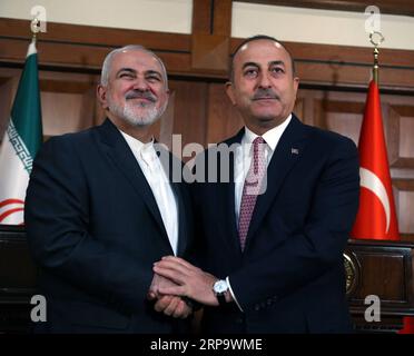 (190417) -- ANKARA, 17 aprile 2019 -- il ministro degli Esteri turco Mevlut Cavusoglu (R) e il suo omologo iraniano Mohammad Javad Zarif partecipano a una conferenza stampa congiunta ad Ankara, in Turchia, il 17 aprile 2019. La Turchia ha sbattuto le sanzioni degli Stati Uniti contro l'Iran, cercando di istituire nuovi meccanismi per migliorare i legami commerciali bilaterali, ha detto mercoledì il ministro degli Esteri Mevlut Cavusoglu. ) TURCHIA-ANKARA-FM-IRAN-FM-MEETING MUSTAFAXKAYA PUBLICATIONXNOTXINXCHN Foto Stock