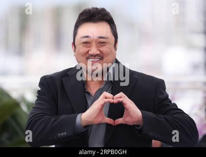 (190523) -- CANNES, 23 maggio 2019 (Xinhua) -- l'attore ma Dong-Seok posa durante un photocall per il gangster, il poliziotto, il diavolo al 72° Festival di Cannes, Francia, 23 maggio 2019. (Xinhua/Gao Jing) FRANCE-CANNES-FILM FESTIVAL- THE GANGSTER, COP, THE DEVIL PUBLICATIONxNOTxINxCHN Foto Stock