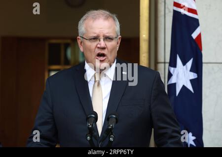 200312 -- CANBERRA, 12 marzo 2020 -- il primo ministro australiano Scott Morrison partecipa a una conferenza stampa presso il Parlamento di Canberra, Australia, 12 marzo 2020. Il governo australiano ha annunciato giovedì un pacchetto di stimolo per il coronavirus da 11,35 miliardi di dollari australiani. Le misure, che valgono più dell'1% del PIL del prodotto interno lordo australiano, includono incentivi agli investimenti accelerati e sussidi salariali per gli apprendisti commerciali. Foto di /Xinhua AUSTRALIA-CANBERRA-COVID-19-ECONOMY-PLAN ChuxChen PUBLICATIONxNOTxINxCHN Foto Stock