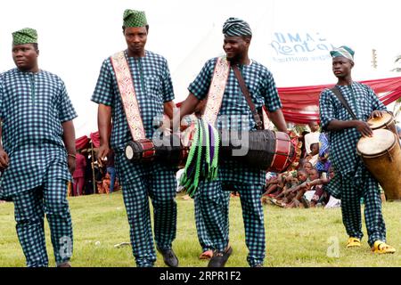 Traditional drummers at the World Sango Festival which is an annual festival held among the Yoruba people in honor of Sango, a thunder and fire deity who was a warrior and the third king of the Oyo Empire after succeeding Ajaka his elder brother. The festival plays host to visitors from all over the country and followers from foreign countries. Oyo state, Lagos, Nigeria. Stock Photo