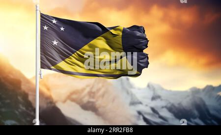 Bandiera di Tokelau su un'asta di bandiera contro un cielo colorato Foto Stock