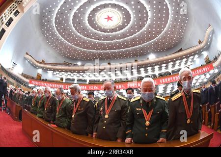 201023 -- PECHINO, 23 ottobre 2020 -- un incontro che segna il 70° anniversario dei volontari cinesi entrati nella Repubblica Popolare Democratica di Corea per combattere nella guerra per resistere all'aggressione e all'aiuto degli Stati Uniti, si tiene presso la sala grande del popolo a Pechino, capitale della Cina, il 23 ottobre 2020. RIUNIONE DI COMMEMORAZIONE DEI VOLONTARI DEL POPOLO CINESE, CINA-PECHINO-CN RAOXAIMIN PUBLICATIONXNOTXINXCHN Foto Stock