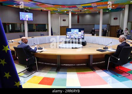 210227 -- BRUXELLES, 27 febbraio 2021 -- il presidente del Consiglio europeo Charles Michel L e il segretario generale della NATO dell'Organizzazione del Trattato del Nord Atlantico Jens Stoltenberg partecipano al secondo giorno del vertice virtuale a Bruxelles, in Belgio, 26 febbraio 2021. Venerdì i leader degli stati membri dell'UE hanno ribadito il loro impegno ad aumentare la capacità dell'UE di agire autonomamente nel contesto del loro dibattito strategico sulla politica europea di sicurezza e di difesa, nonché la necessità che il blocco si assuma maggiori responsabilità per la sua sicurezza. Concludendo un vertice virtuale di due giorni, i capi di Stato e di governo agr Foto Stock