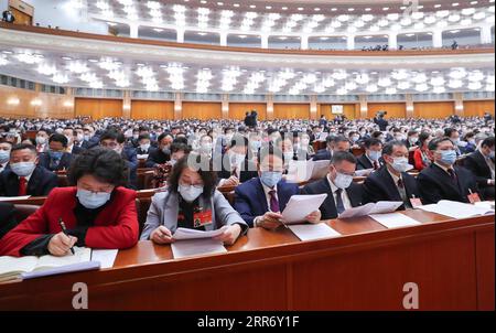 210304 -- PECHINO, 4 marzo 2021 -- i membri del 13° Comitato Nazionale della Conferenza consultiva politica del popolo cinese CPPCC partecipano alla riunione di apertura della quarta sessione del 13° Comitato Nazionale del PCC presso la sala grande del popolo a Pechino, capitale della Cina, 4 marzo 2021. DUE SESSIONSCHINA-PECHINO-CPPCC-SESSIONE ANNUALE-APERTURA CN WANGXYE PUBLICATIONXNOTXINXCHN Foto Stock