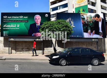 210517 -- DAMASCO, 17 maggio 2021 -- poster dei candidati presidenziali siriani sono visti a Damasco, Siria, 16 maggio 2021. Le campagne presidenziali siriane sono ufficialmente iniziate domenica, con manifesti del presidente Bashar al-Assad e degli altri due candidati che hanno riempito le piazze e le strade della capitale Damasco. Foto di /Xinhua SIRIA-DAMASCO-CAMPAGNE PRESIDENZIALI AmmarxSafarjalani PUBLICATIONxNOTxINxCHN Foto Stock