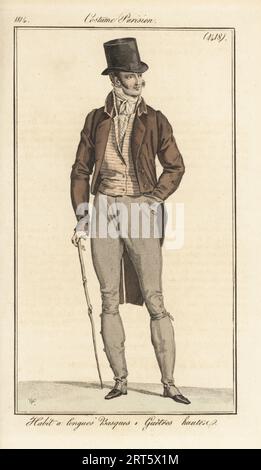 Gentleman francese con cappello, camice a coda lunga, gilet a righe, pantaloni con ghette alte. Abitudine a longues Basques, Guetres hautes. Incisione in copperplate a mano di Pierre-Charles Baquoy su un piatto di moda di Horace Vernet dal Journal des Dames et des Modes di Pierre de la Mesangere, Magazine of Women and Fashion, Parigi, 1814. Foto Stock