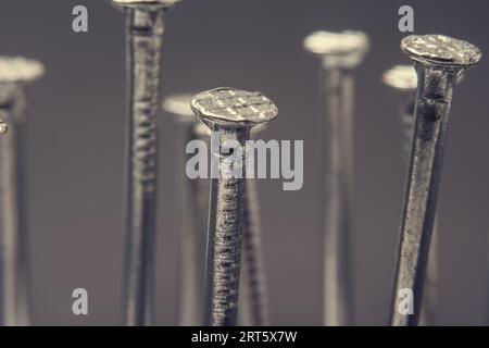 Primo piano sullo sfondo delle unghie di ferro Foto Stock