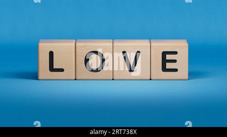 Cuore d'amore. I cubi formano la parola amore. Love and valentine's Day Concept.rendering 3D su sfondo blu. Foto Stock