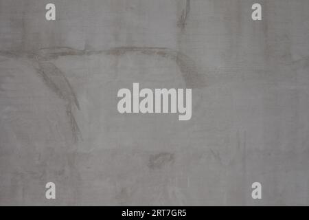 Edificio in intonaco con sfondo a parete grigio Foto Stock