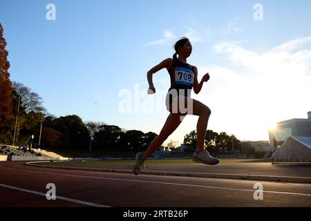 Atleta giapponese in esecuzione su via Foto Stock