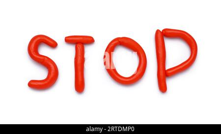 STOP rosso composto da impasto su sfondo bianco Foto Stock