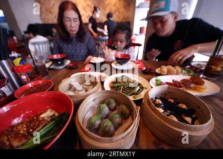 Un popolare ristorante dim sum. Ho chi Minh. Vietnam. Foto Stock