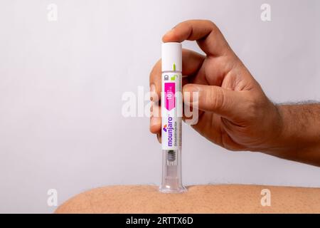 foto dell'iniezione di penna diabetica sulla pelle Foto Stock