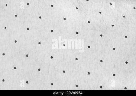 Tessuto bianco vintage con motivo astratto sfondo a pois nero. Foto Stock